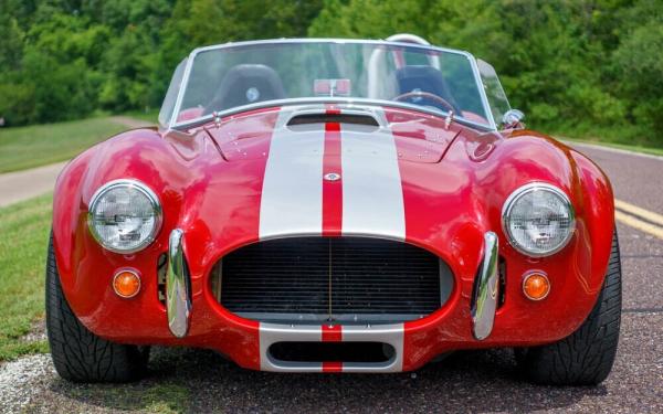 1965 Factory Five Mk IV Cobra Roadster Replica Red exterior with dual silver racing stripes