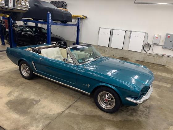 1965 Ford Mustang convertible in Dynasty Green with white manual top